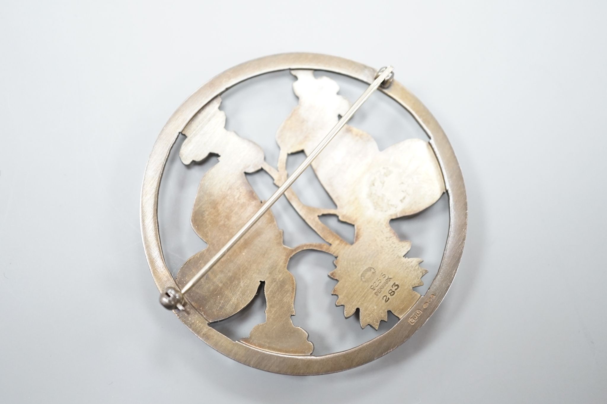 A modern George Jensen sterling twin moth circular brooch, no. 283, 54mm.
